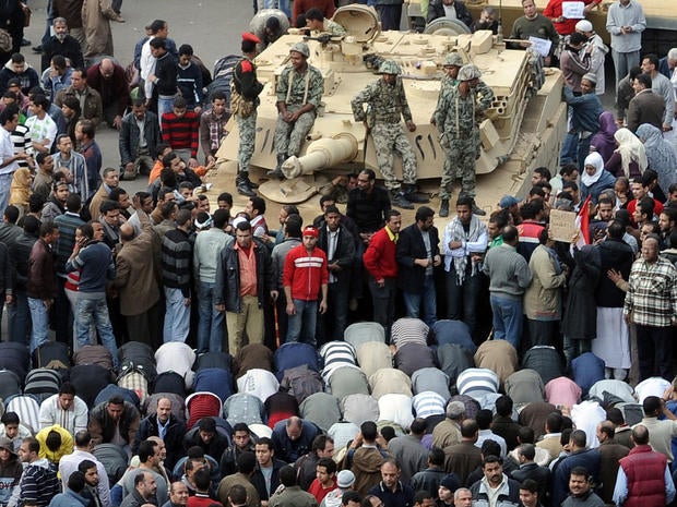 Protesters, Egyptian troops in Tahir Square.
