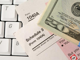 studio shot of tax form and keyboard