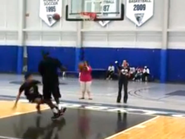 LeBron James dunking on kid
