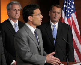 House Speaker John Boehner of Ohio, right, and House Majority Whip Kevin McCarthy of Calif., left, listen as House Majority Leader Eric Cantor of Va., center, speaks during a news conference on Capitol Hill in Washington, Thursday, July 28, 2011.