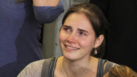 Amanda Knox is comforted by her sister, Deanna Knox, during a news conference shortly after her arrival at Seattle-Tacoma International Airport Oct. 4, 2011, in Seattle
