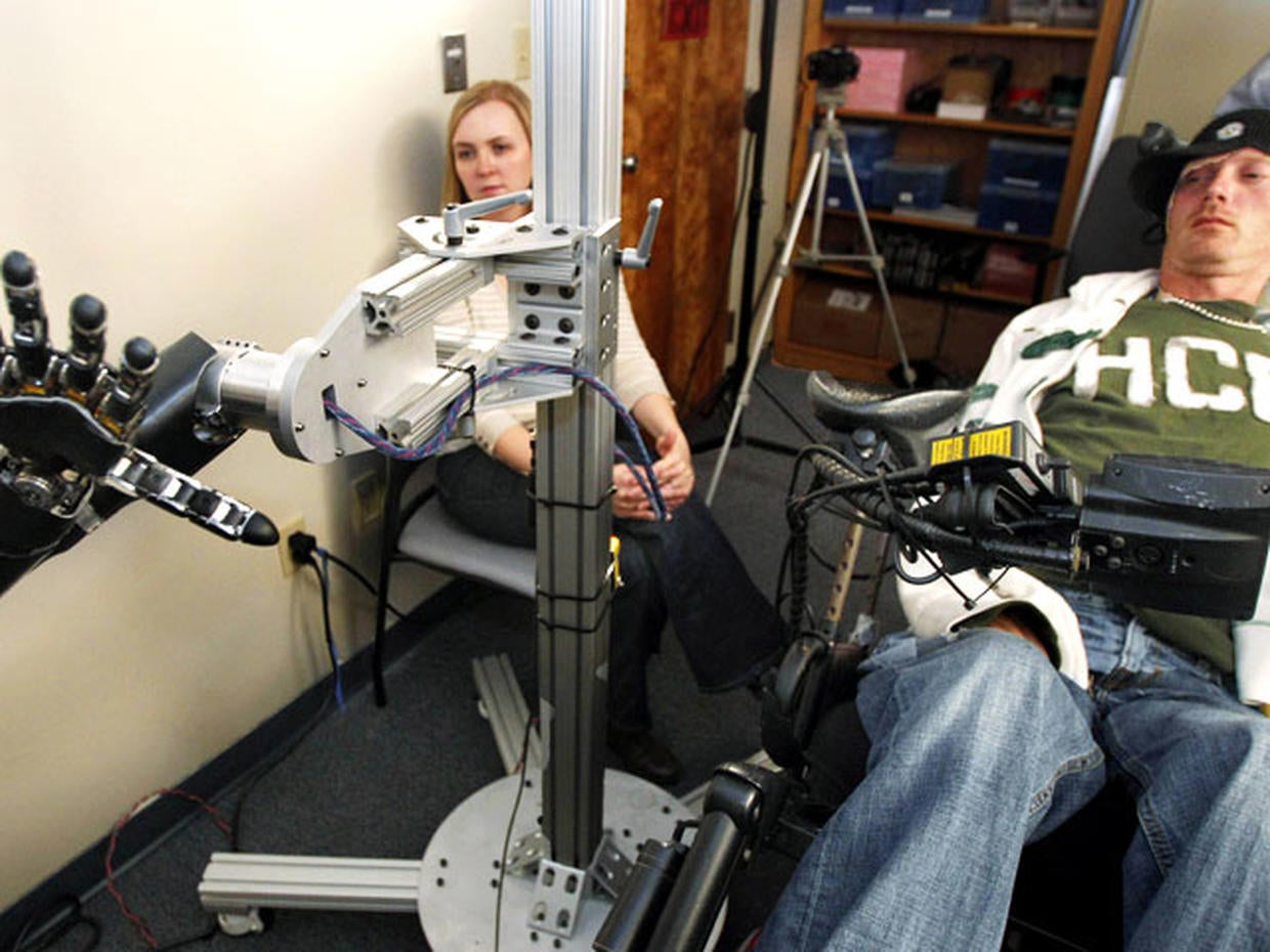 Robotic arm lets paralyzed man touch girlfriend Photo 1 Pictures
