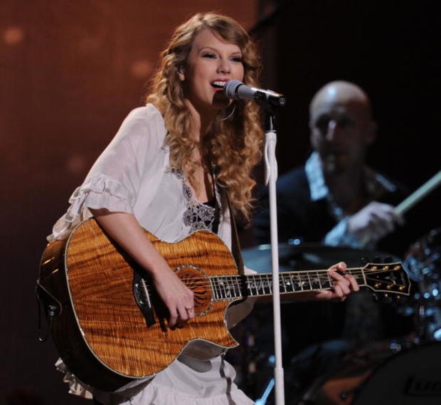 Taylor Swift performs at the 52nd Annual Grammy Awards. 