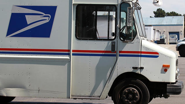 U.S. Postal Service trucks are seen parked near the loading dock at the U.S. Post Office sort center Aug. 12, 2011, in San Francisco. 