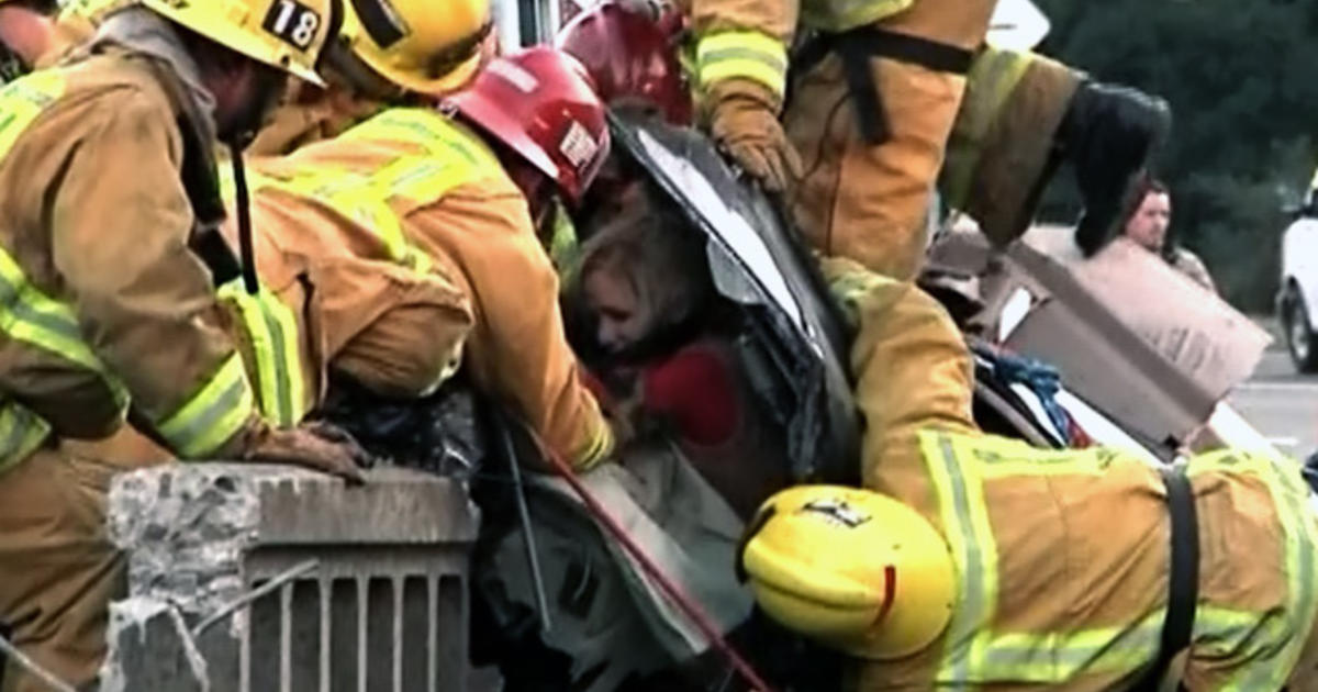 Mom, kids rescued as BMW teeters on SoCal bridge - CBS News