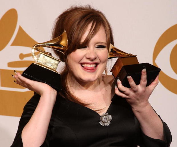 British singer Adele holds her 2009 Grammy awards. 