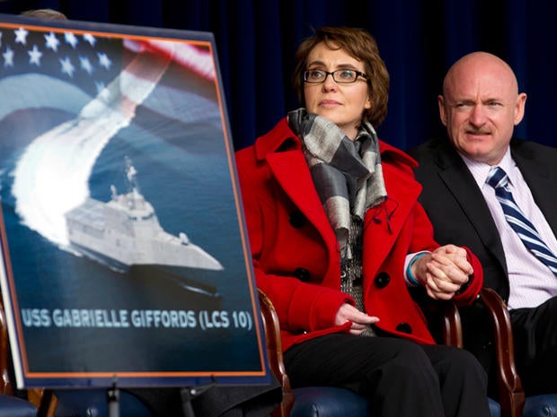 Former Arixona Rep. Gabrielle Giffords and her husband Mark Kelly, attend a ceremony at the Pentagon, Friday, Feb. 10, 2012, for the unveiling of the USS Gabrielle Giffords. The Navy has named a ship for Gabrielle Giffords, the recently retired congresswoman from Arizona who is recovering from a gunshot wound to the head received in January 2011.