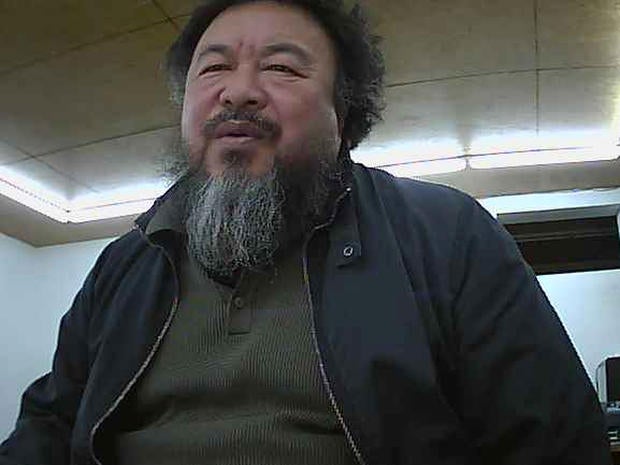 Ai Weiwei appears on a webcam in his home
