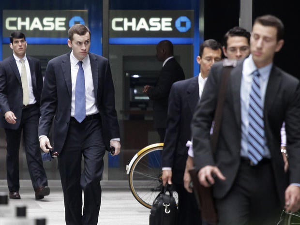 People arrive at JPMorgan Chase headquarters in New York Monday, May 14, 2012. JPMorgan, the largest bank in the United States, is seeking to minimize the damage caused by a $2 billion trading loss, disclosed Thursday by CEO Jamie Dimon.