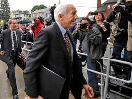 Former Penn State University assistant football coach Jerry Sandusky, center, arrives with his attorney Joe Amendola June 5, 2012, for the first day of jury selection at a courthouse in Bellefonte, Pa.