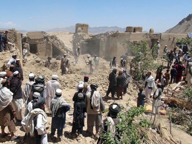 Afghans at scene of apparent air strike