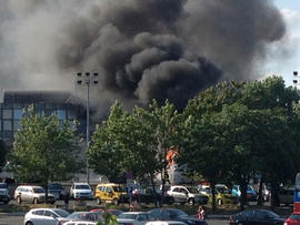 Smoke rises into the sky after an explosion at Burgas airport, outside the Black Sea city of Burgas, Bulgaria, some 400 kilometers (250 miles) east of the capital, Sofia, Wednesday, July 18, 2012.