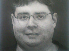 This image provided to CBS News by sources shows Neil Prescott, who was found in possession of 25 guns after allegedly making threats to carry out a workplace shooting.