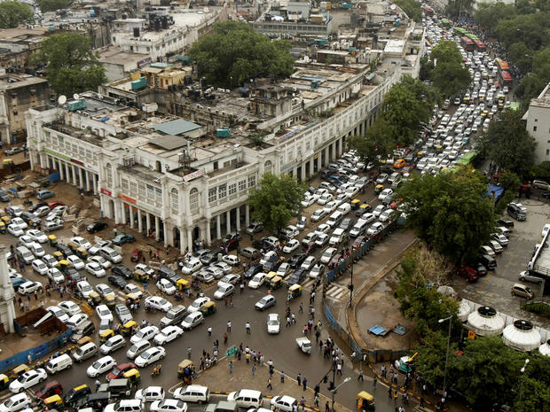 Streets are packed in heavy traffics following power outage and rains in the central part of New Delhi, India, Tuesday, July 31, 2012.