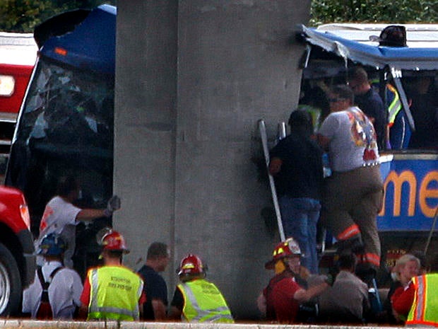 First responders work the scene of a Megabus crash on Interstate 55 near Litchfield, Ill., Aug. 2, 2012.