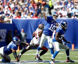 Eli Manning passes under pressure