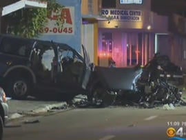 Three people were killed Saturday when a car that was apparently drag racing slammed into an SUV carrying a couple and their two sons.