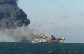 In this image released by a oil field worker and obtained by the Associated Press, a fire burns on a Gulf oil platform Friday, Nov. 16, 2012, after an explosion on the rig, in the Gulf of Mexico off the Louisiana coast.