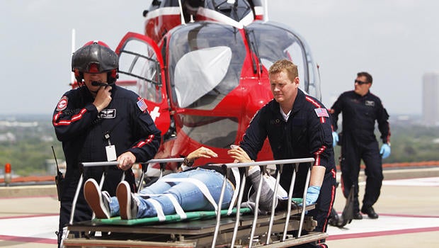 Life Flight personnel rush a victim wounded in a stabbing attack on the Lone Star community college system's Cypress, Texas campus into Memorial Hermann Hospital Tuesday, April 9, 2013, in Houston.