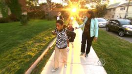 Charmin Leon takes her children to school in Cleveland.