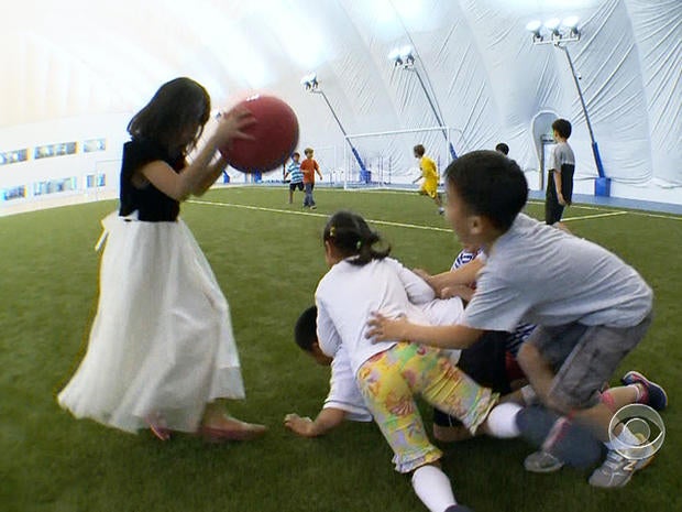 Kids play in the dome built by the International School of Beijing.