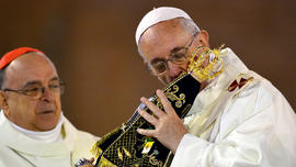 Pope Francis celebrates Mass at the Basilica of the National Shrine of Our Lady Aparecida on July 24, 2013 in Aparecida, Brazil. The shrine attracts millions each year and honors the dark-skinned Virgin of Aparecida, who is considered the patron saint of Brazil. Pilgrims throughout the world are joining Pope Francis for his visits to various locations in Brazil from July 22- July 28 during the Catholic Church's World Youth Day celebrations.