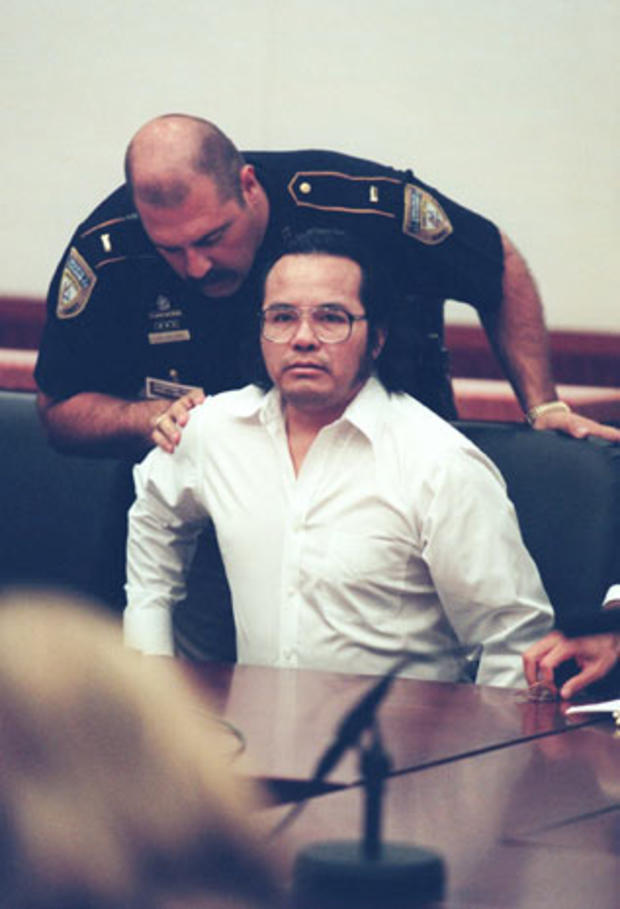 A Harris County sheriff's deputy confers with accused serial killer Angel Maturino Resendiz at the start of his capital murder trial for the murder of Dr. Claudia Benton on May 8, 2000, in Houston. Jurors would eventually reject his plea of not guilty by 