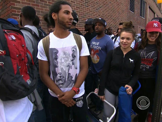 Job-seekers line up for a carpenter apprenticeship in New York in a "CBS Evening News" segment broadcast Aug. 21, 2013.