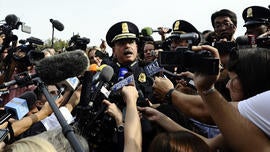 US Capitol Hill Police Chief Kim Dine briefs the media after shots fired were reported near 2nd Street NW and Constitution Avenue on Capitol Hill in Washington, DC, on October 3, 2013. The US Capitol was placed on security lockdown Thursday after shots were fired outside the complex, senators said. 'Shots fired outside the Capitol. We are in temporary lock down,' Senator Claire McCaskill said on Twitter. Police were seen running within the Capitol building and outside as vehicles swarmed to the scene.
