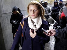 Genevieve Sabourin, who is charged with stalking actor Alec Baldwin, speaks with reporters as she arrives for her trial at criminal court on Nov. 12, 2013, in New York.
