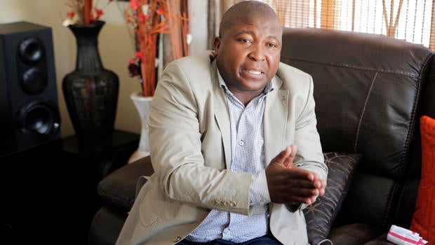 Thamsanqa Jantjie gestures at his home during an interview with The Associated Press in Johannesburg Dec. 12, 2013. Jantjie, the man accused of faking sign interpretation next to world leaders at Nelson Mandela's memorial, told a local newspaper that he w
