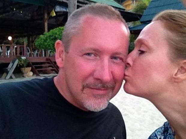 A photo provided by Sarah Bajc shows her kissing long-time boyfriend Phil Wood