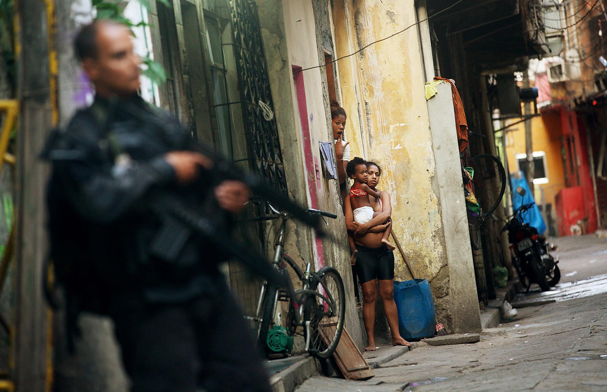 Rio De Janeiro Brazilian Security Forces Raid Rio Slums Ahead Of World Cup Pictures Cbs News