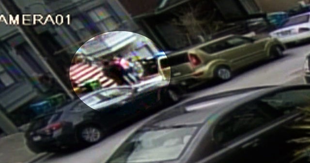 Armed robbery in broad daylight caught on tape CBS News