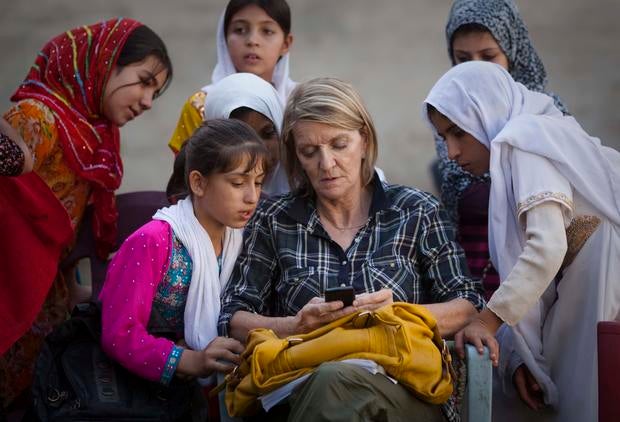 AP Special Regional Correspondent for Afghanistan and Pakistan Kathy Gannon sits with girls at a school in Kandahar