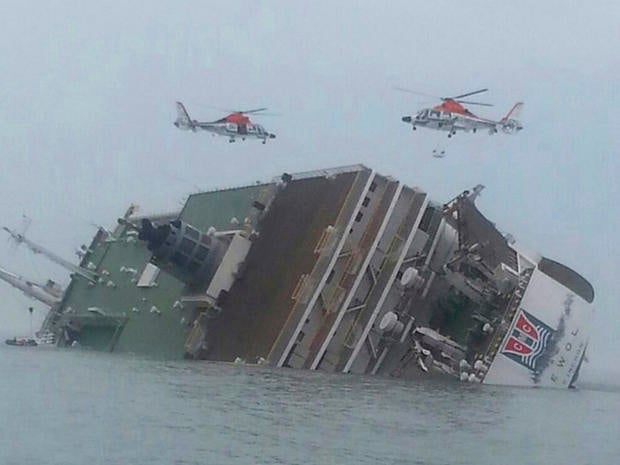 Helicopters hover over a South Korean passenger ferry as it sinks off the nation's southwest coast