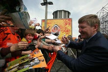 Rinat Akhmetov signs autograph after unveiling his star on the newly opened FC Shakhtar Walk of Fame in Donetsk