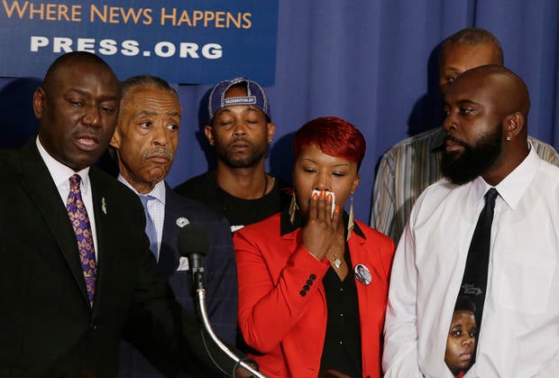 (L-R front) Brown family attorney Benjamin Crump, U.S. civil rights leader Rev. Al Sharpton, the parents of Michael Brown, Lesley McSpadden and Michael Brown, Sr.