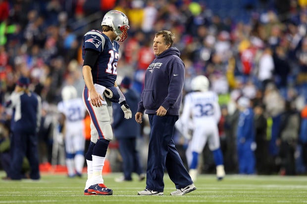 New England Patriots quarterback Tom Brady talks with head coach Bill Belichick before the AFC championship game against the Indianapolis Colts at Gillette Stadium Jan. 18, 2015, in Foxboro, Massachusetts.