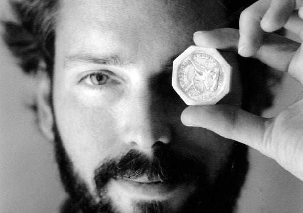 Tommy Thompson holds a $50 pioneer gold piece retrieved earlier in 1989 from the wreck of the gold ship SS Central America