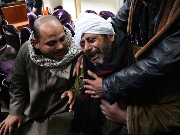 Relatives of Egyptian Coptic Christians purportedly murdered by ISIS militants in Libya react after hearing the news 