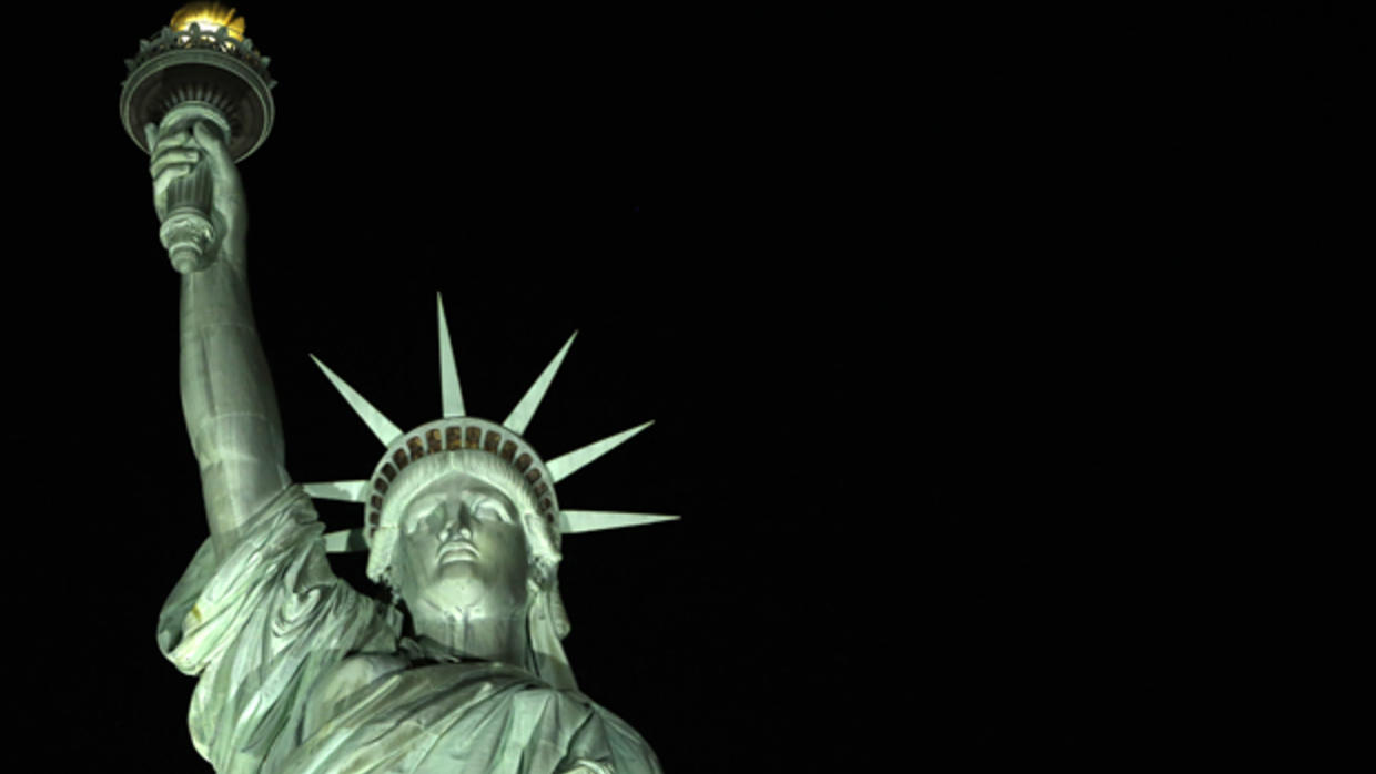 Statue of Liberty seen in bright glow after lighting system changed to