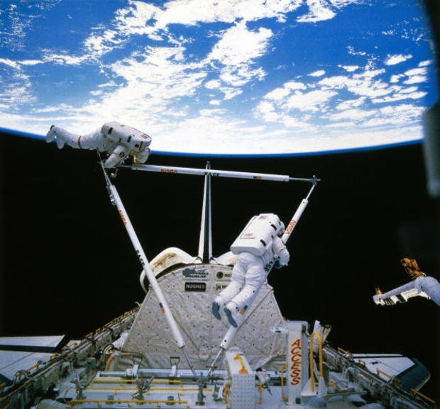 Shuttle astronauts on Extra Vehicular Activity (EVA), 1985. 