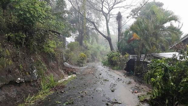 Debris covers road after heavy rains from Tropical Storm Erika on Caribbean island of Dominica in this picture from Robert Tonge, Dominican Minister for Tourism and Urban Renewal, taken August 27, 2015