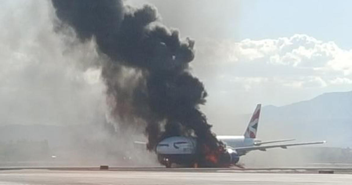 Plane catches fire on Las Vegas runway CBS News