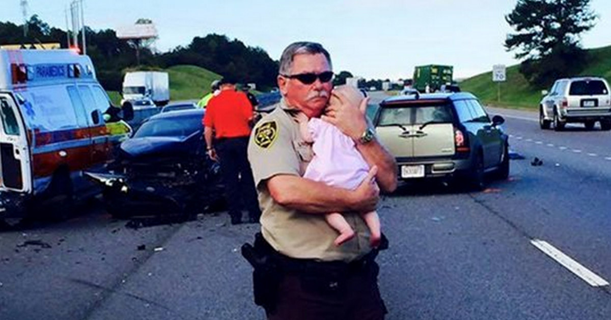 Deputy comforts crying baby after traffic accident in Alabama CBS News