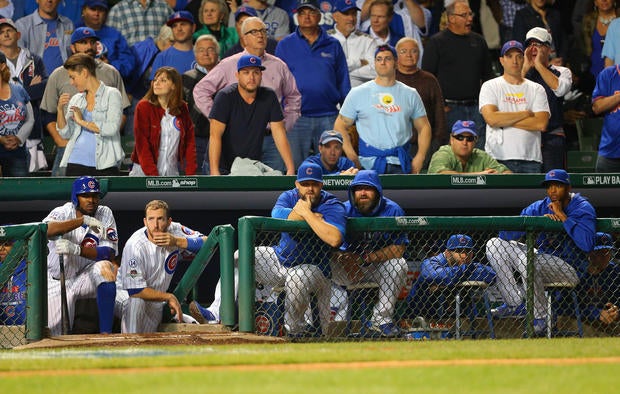 Chicago Cubs in their dugout in ninth inning of NLCS game four against New York Mets, who won, 8-3, to sweep the series and move on to World Series
