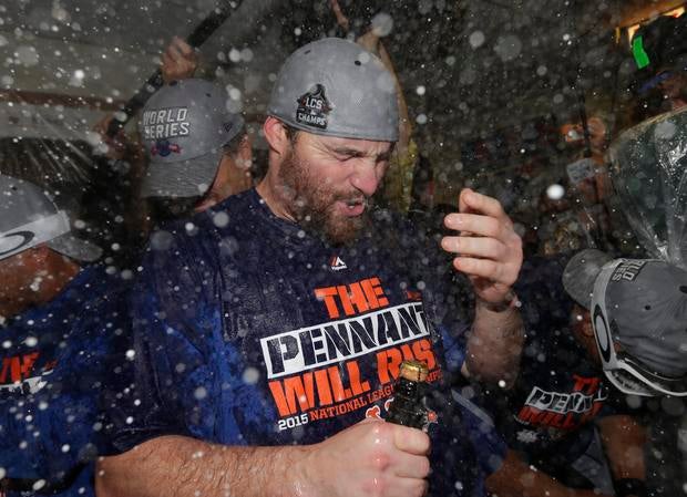 New York Mets second baseman Daniel Murphy celebrates with champagne in clubhouse after Mets defeating Chicago Cubs to win NLCS at Wrigley Field on October 21, 2015 and advance to World Series