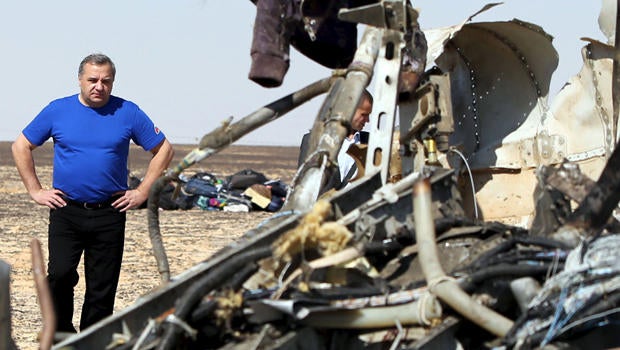 Russian Emergencies Minister Vladimir Puchkov looks at debris from a Russian airliner at its crash site in the Hassana area in el-Arish, Egypt, Nov. 1, 2015.