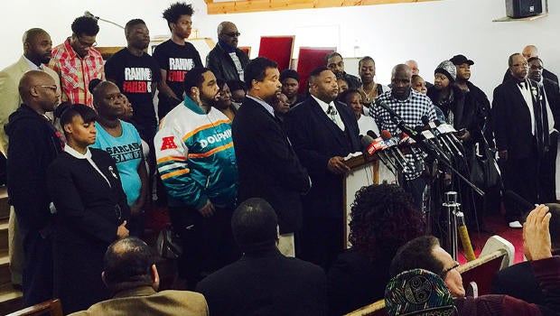 The Rev. Marvin Hunter, center, the great-uncle of Laquan McDonald, accompanied by other family members and supporters, speaks at a news conference Dec. 11, 2015, in Chicago.